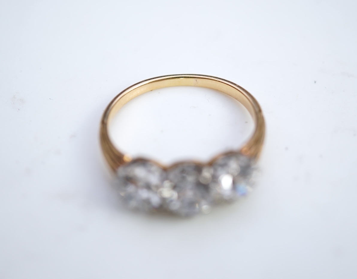 An attractive three-stone diamond ring, early 20th century